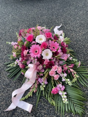 Casket flowers in pinks